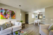 Thumbnail 5 of 20 - Vista Promenade Apartments in Temecula - Living Room with Stylish Decor, Hardwood Floor , Beige Walls and Cozy Fire Place
