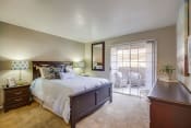 Thumbnail 6 of 20 - One-Bedroom Apartments in Temecula, CA- Vista Promenade- Wall-to-Wall Carpeting with Entrance to Patio and Stylish Decor
