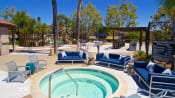 Thumbnail 13 of 20 - Apartments in Temecula, CA - Vista Promenade Sparkling Swimming Pool Surrounded By Lush Landscaping and Lounge Seating