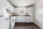 Thumbnail 5 of 17 - a kitchen with white appliances and white cabinets at Jacksonville Heights Apartments