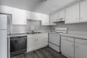 Thumbnail 16 of 17 - kitchen with white cabinets and appliances at Jacksonville Heights Apartments