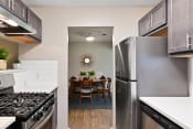 Thumbnail 7 of 37 - a kitchen and dining area in a 555 waverly unit