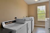 Thumbnail 22 of 44 - On site laundry room with washers and dryers at The Reserves of Thomas Glen, Shepherdsville, KY, 40165