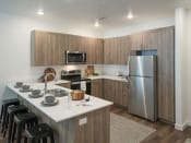 Thumbnail 9 of 33 - Well Equipped Eat-In Kitchen at Foothill Lofts Apartments & Townhomes, Logan, UT, 84341