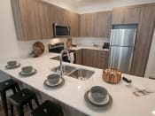 Thumbnail 10 of 33 - Quartz Countertop Kitchen at Foothill Lofts Apartments & Townhomes, Logan, UT, 84341