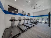 Thumbnail 15 of 21 - Cardio Machines In Gym at Chesapeake Commons Apartments, California, 95670