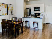 Thumbnail 23 of 61 - Open Concept Kitchen with Light Cabinetry at Parc at Day Dairy Apartments and Townhomes, Draper, 84020