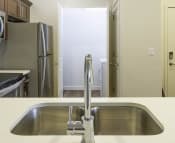 Thumbnail 7 of 39 - Fully Equipped Kitchen and Laundry Room at Four Seasons Apartments & Townhomes, North Logan