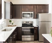 Thumbnail 2 of 39 - Fully Equipped Kitchen With Stainless Steel Appliances at Rivulet Apartments, American Fork, UT