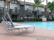 Thumbnail 12 of 42 - Poolside Lounging at Canyon Club Apartments