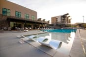 Thumbnail 31 of 44 - Pool Side Lounge Area With Sundeck at Soleil Lofts Apartments, Utah, 84096