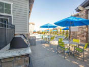 Thumbnail 36 of 38 - Barbecue And Grilling Station with sitting space at Parc on Center Apartments & Townhomes, Orem, Utah