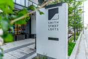 Thumbnail 36 of 41 - a sign in front of a building that says smith street lofts