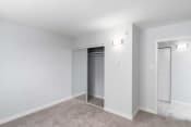 Thumbnail 9 of 26 - a bedroom with grey carpet and white walls