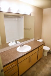 Thumbnail 26 of 54 - Bathroom with mirror and cupboards at Graymayre Crossing Apartments, Spokane, Washington