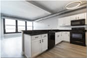 Thumbnail 57 of 82 - a kitchen with white cabinets at Marshall Place