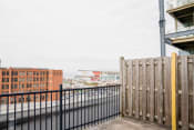 Thumbnail 54 of 82 - the view of the city from the deck of a building with a fence