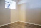Thumbnail 50 of 82 - an empty room with a window and wooden floors