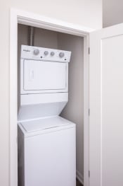 Thumbnail 16 of 40 - a white washer and dryer in a closet