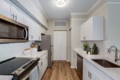 Thumbnail 7 of 33 - Kitchen with white cabinetry | Ashlar Fort Myers