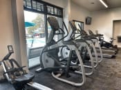 Thumbnail 7 of 14 - a row of treadmills and elliptical trainers in a gym