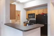 Thumbnail 23 of 46 - Updated Kitchen With Black Appliances| Cypress Legends