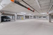 Thumbnail 19 of 59 - an empty parking garage with a car parked in it