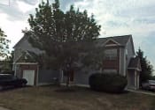 Thumbnail 6 of 18 - a house with a tree in front of it