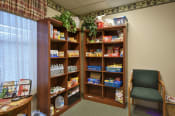 Thumbnail 43 of 65 - a room with a chair and some food on shelves