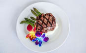 Thumbnail 12 of 55 - a plate of food with a steak and mashed potatoes on it