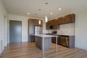 Thumbnail 13 of 36 - a kitchen with stainless steel appliances and a white counter top