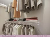 Thumbnail 17 of 58 - a rack of clothes hanging in a closet