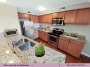 Thumbnail 16 of 58 - a kitchen with stainless steel appliances and granite counter tops