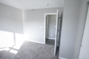 Thumbnail 10 of 11 - Empty bedroom with a door open at Canterbury House apartments in Logansport, Indiana