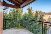 Thumbnail 16 of 46 - Apartments for Rent in Fairview - Lodges at Lake Salish - Large Covered Patio with Metal Railing and Gorgeous Landscape Views