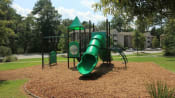 Thumbnail 9 of 18 - a playground with a green slide and monkey bars