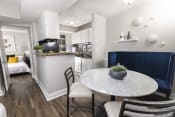 Thumbnail 3 of 18 - a kitchen and dining area in a 555 waverly unit