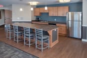 Thumbnail 11 of 26 - Community kitchen with serving bar perfect for entertaining