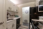 Thumbnail 1 of 37 - This is a photo of the kitchen in a 692 square foot 1 bed, 1 bath model aprtment at Cambridge Court Apartments in Dallas Texas
