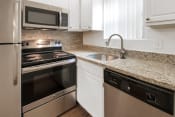 Thumbnail 10 of 37 - This is a photo of the kitchen in the 450 square foot efficiency apartment at Cambridge Court Apartments in Dallas, TX.