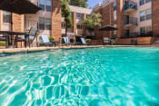 Thumbnail 30 of 37 - This is a photo of the primary pool area at Cambridge Court Apartments in Dallas, TX.