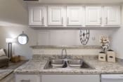 Thumbnail 14 of 37 - This is a photo of the kitchen of the 515 square foot 1 bedroom apartment at Canyon Creek Apartments in Dallas, TX