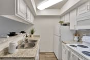 Thumbnail 1 of 37 - This is a photo of the kitchen in the 477 square foot 1 bedroom apartment at Canyon Creek Apartments in Dallas, TX.