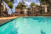 Thumbnail 32 of 37 - This is a photo of the pool area at Canyon Creek Apartments in Dallas, TX.