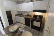 Thumbnail 1 of 32 - This is a photo of the kitchen in the 740 square foot 1 bedroom model apartment at Compton Lake Apartments in Mt. Healthy, OH.