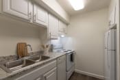 Thumbnail 15 of 70 - Kitchen With White Cabinets at Princeton Court, Texas