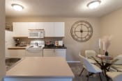 Thumbnail 26 of 75 - This is a photo of the kitchen and dining room of the 890 square foot 2 bedroom, 2 bath Liberty at Washington Place Apartments in in Miamisburg, Ohio in Washington Township.