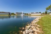 Thumbnail 69 of 75 - This is a photo of a pond with a fountain and building exteriors at Washington Place Apartments in Miamisburg, Ohio in Washington Township.
