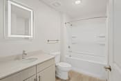 Thumbnail 30 of 71 - a bathroom with a sink toilet and a showerat Metropolis Apartments, Virginia, 23060