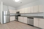 Thumbnail 6 of 71 - a kitchen with white cabinets and stainless steel appliancesat Metropolis Apartments, Glen Allen, VA
